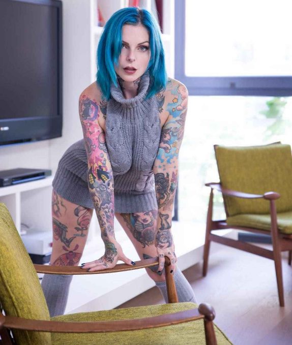 Explore the unique beauty of Riae’s tattoos and be mesmerized by her captivating body art!