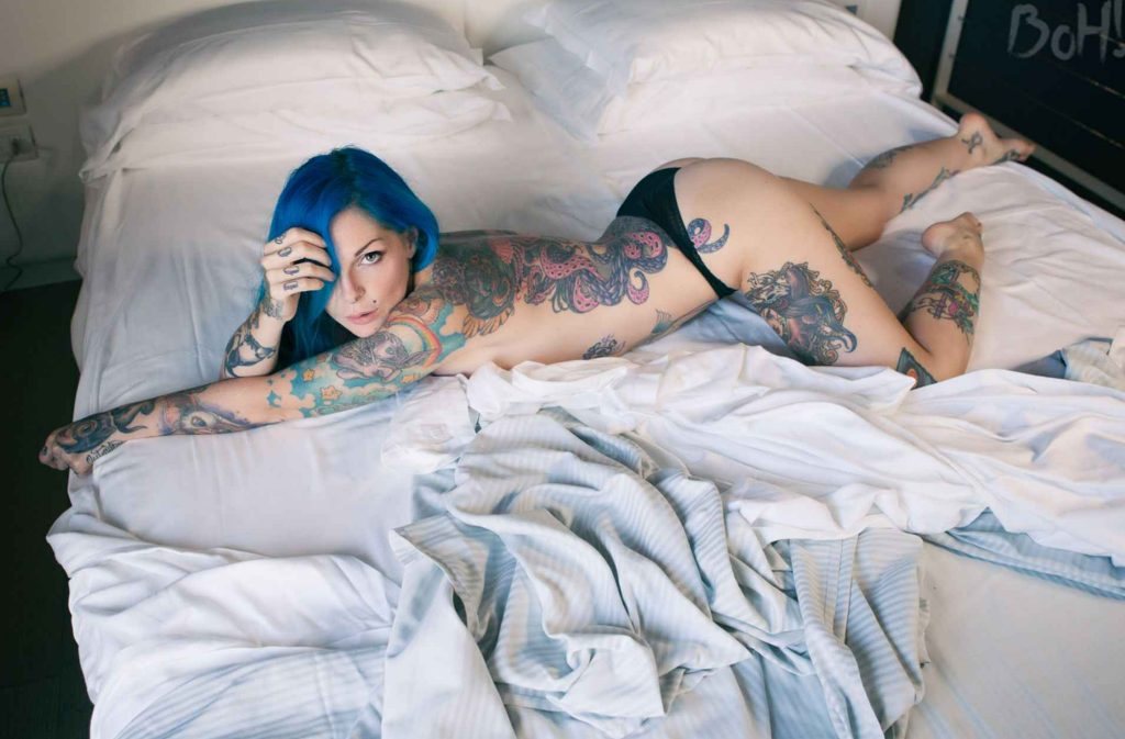 Explore the unique beauty of Riae’s tattoos and be mesmerized by her captivating body art!