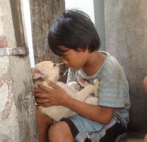 After Being Abandoned By His Parents This Boy Found Love In The Dogs Arms