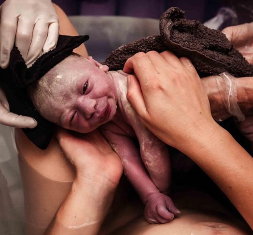 These photographs capture the most tender moments of the seventh child's birth.