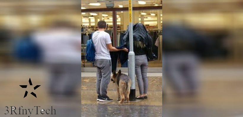 Discovering the dog tied up in the rain, the couple used their coats and umbrellas to cover it - Juligal