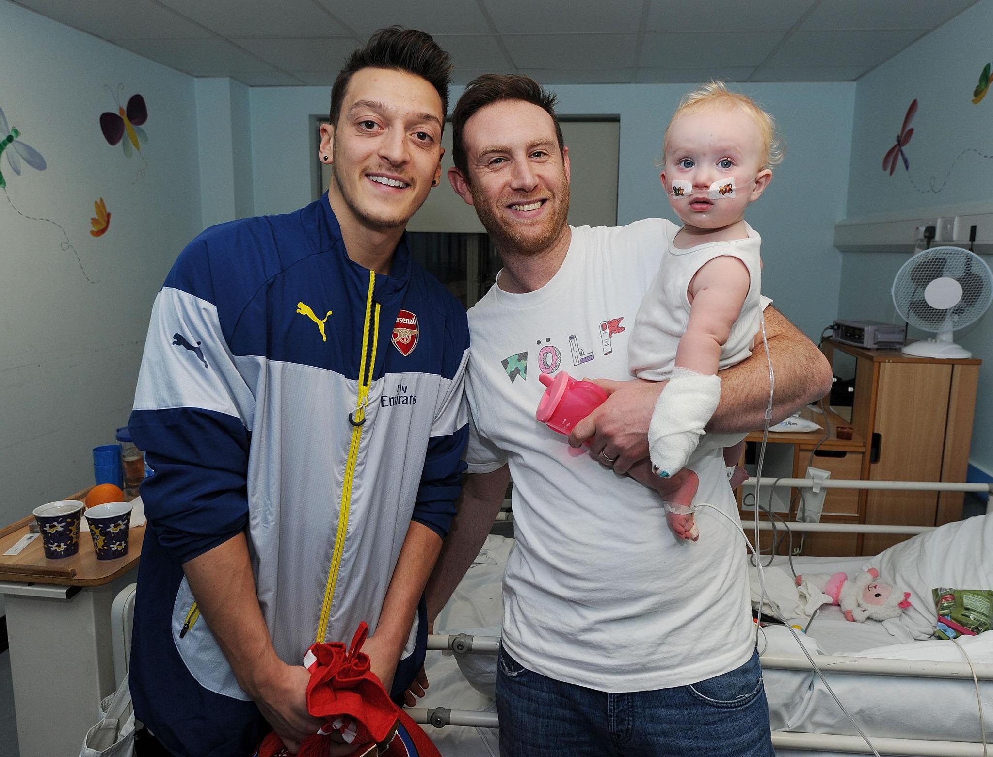 Arsenal star Mesut Ozil shares heartwarming pics of kids whose lives he has changed after paying for 219 operations