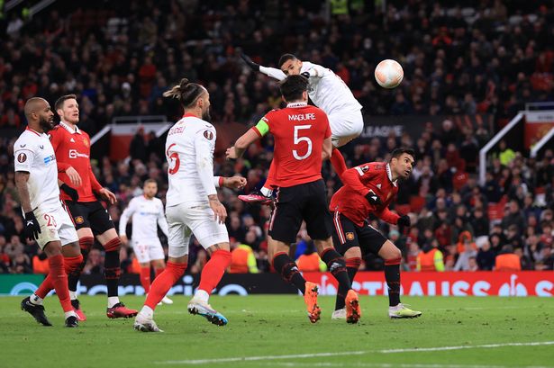 Harry Maguire of Manchester United scores an own goal to equalize for Sevilla during the UEFA Europa League quarterfinal first leg match between Manchester United and Sevilla FC at Old Trafford on April 13, 2023