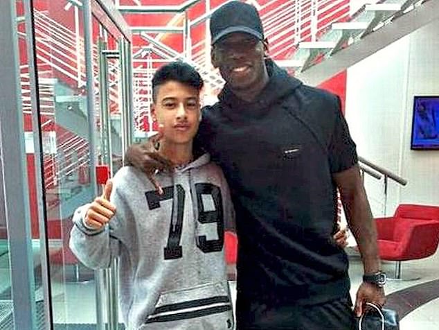 The young Brazilian is pictured next to French international and World Cup winner Paul PogƄa