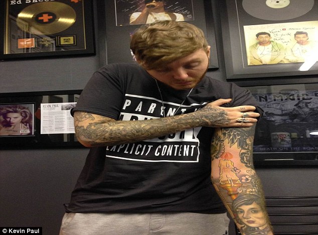 James Arthur adds to his tattoo collection with an inking of a flaming  candle | Daily Mail Online