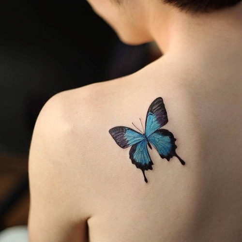 blue morpho butterfly tattoo on the left shoulder