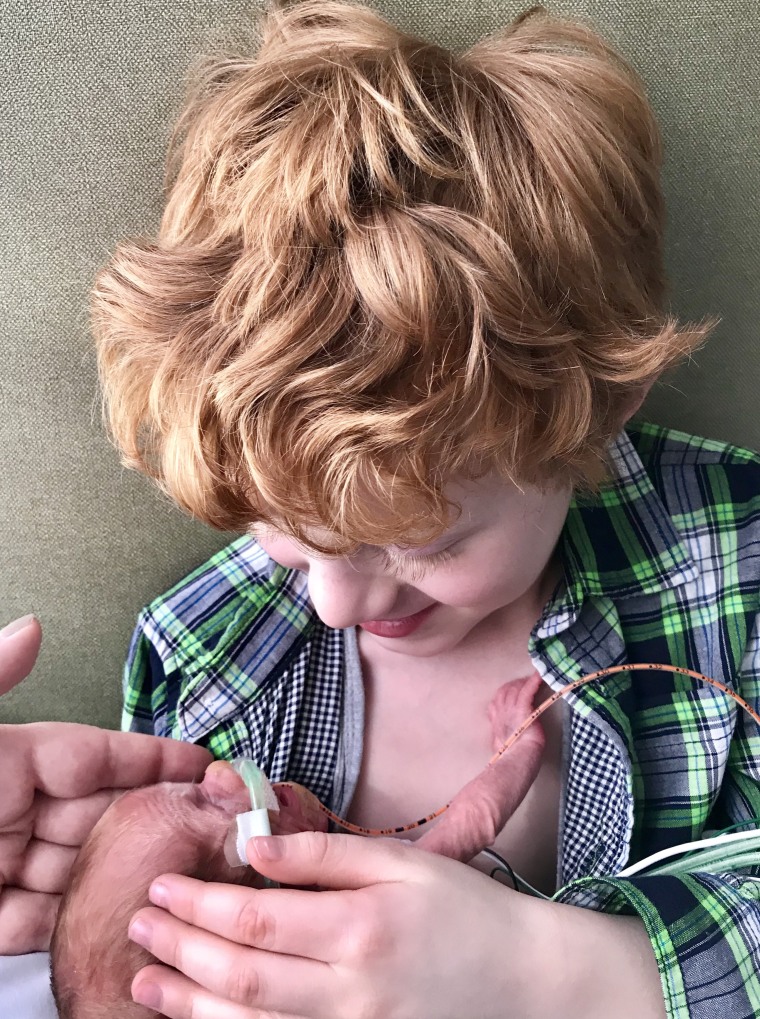 A 6-year-old brother hugged his premature infant in a touching moment