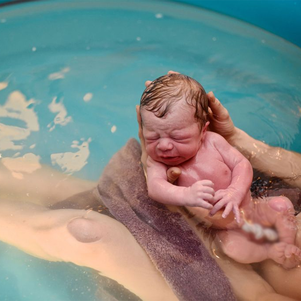 These twelve heart-wrenching photographs illustrate a real water birth.