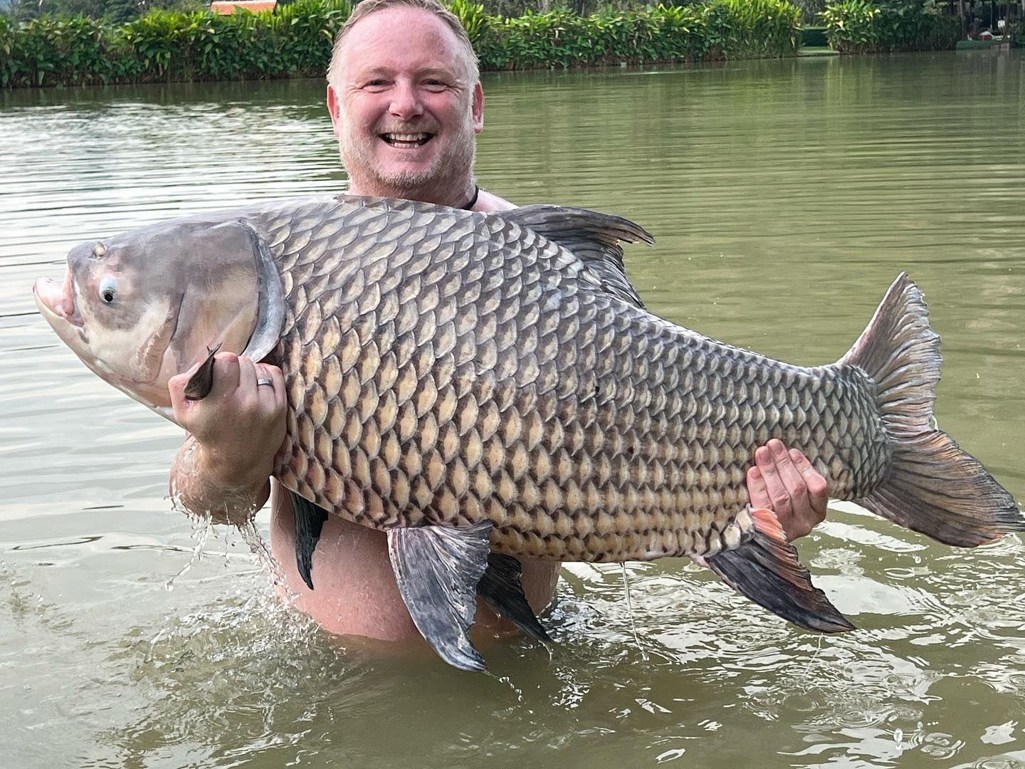 Man Utd Treble winner unrecognisable with greying ginger stubble as he poses with huge fish and leaves Scholes stunned