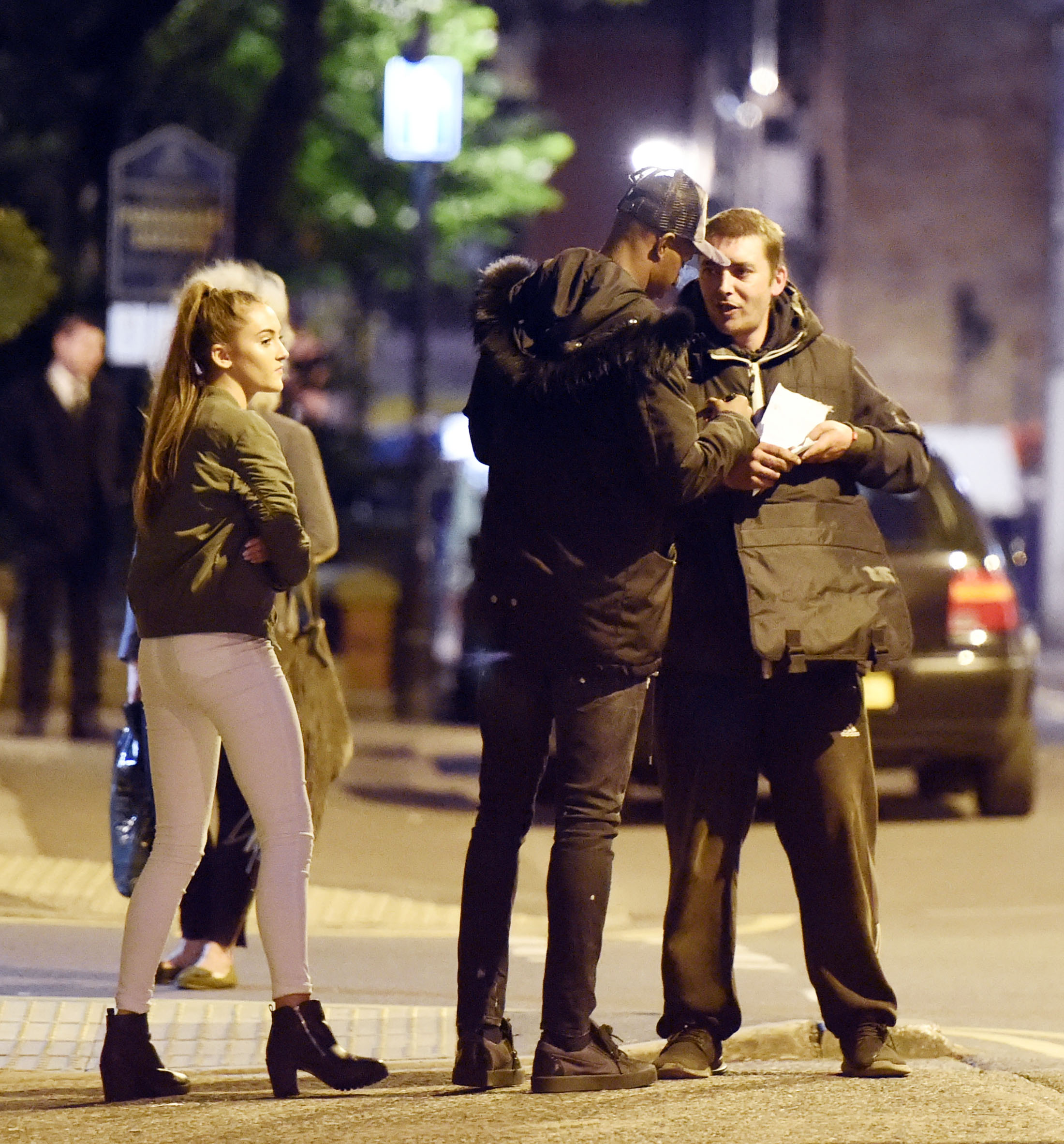 Young forward snapped on the way home from restaurant with brunette, even taking time to sign an autograph for a fan