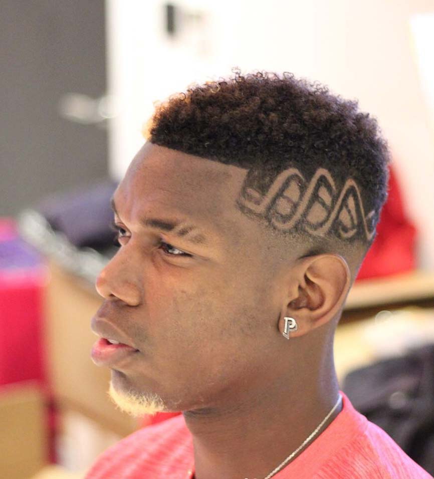 Image may contain Face Human Person Hair Head Tattoo Skin and David Neres