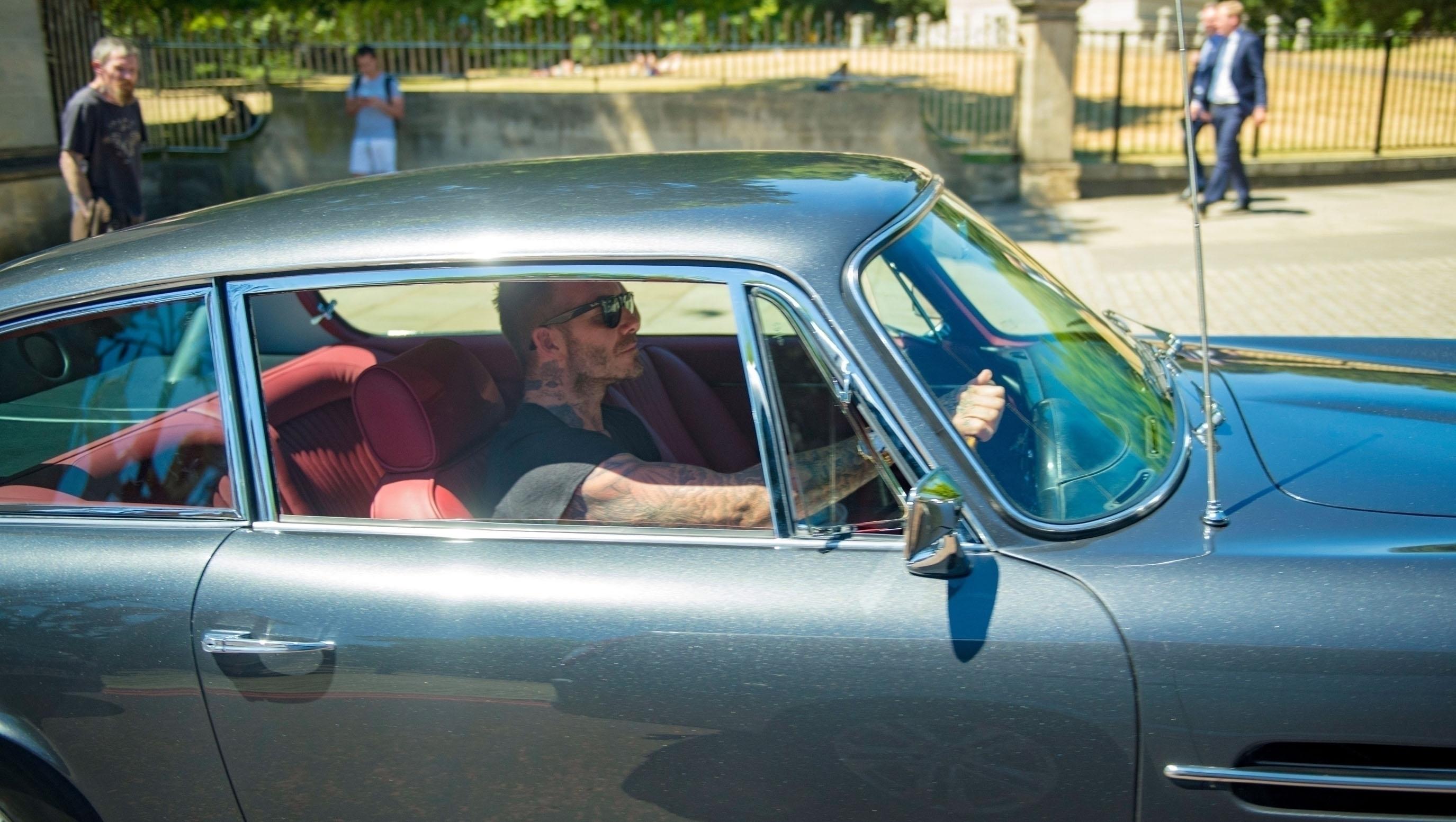  David Beckham looked uber cool at the wheels of the snazzy classic car