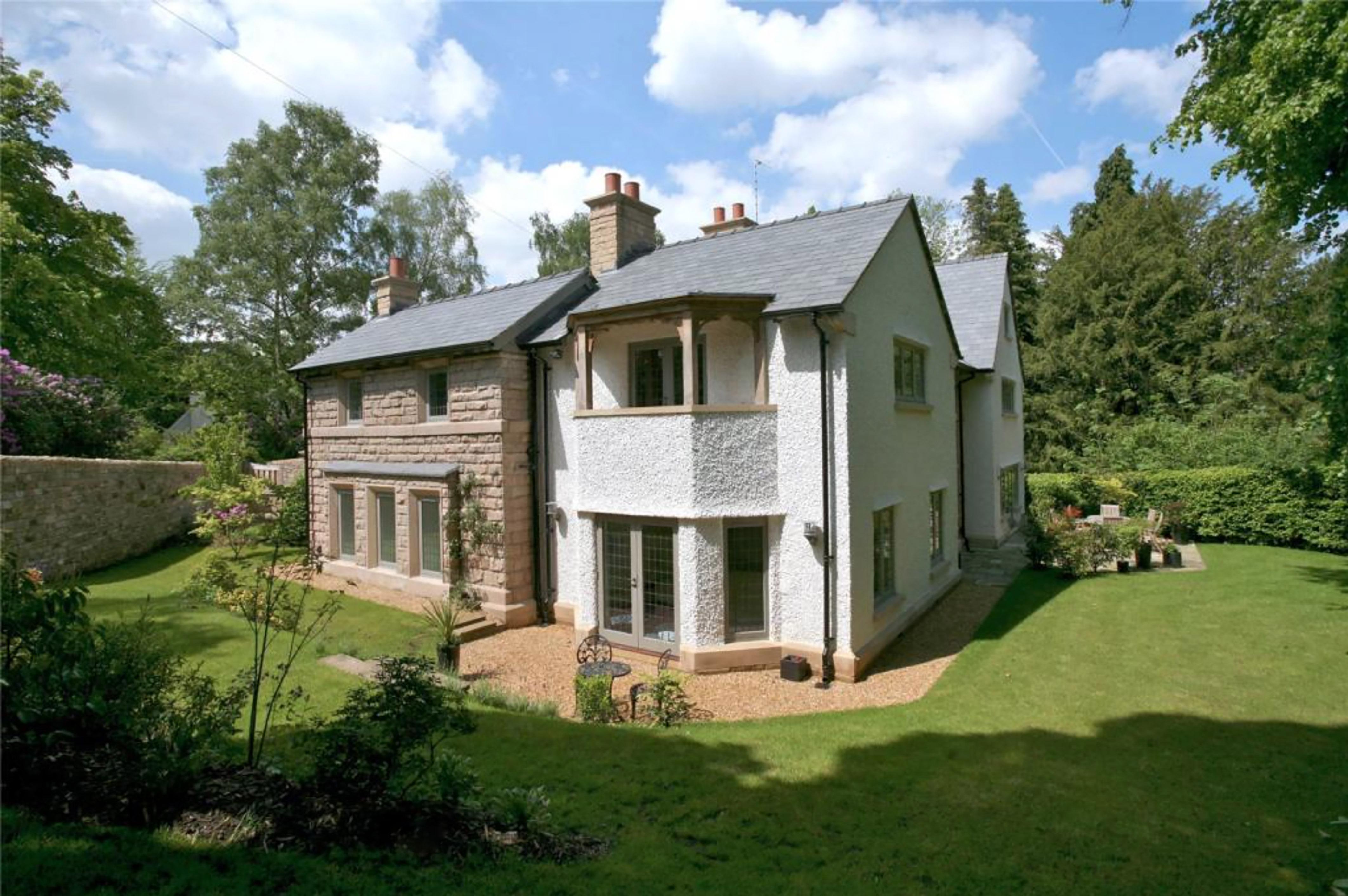  The family home on the outskirts of leafy Wilmslow boasts 'an exceptional bespoke interior nestled in mature gardens'