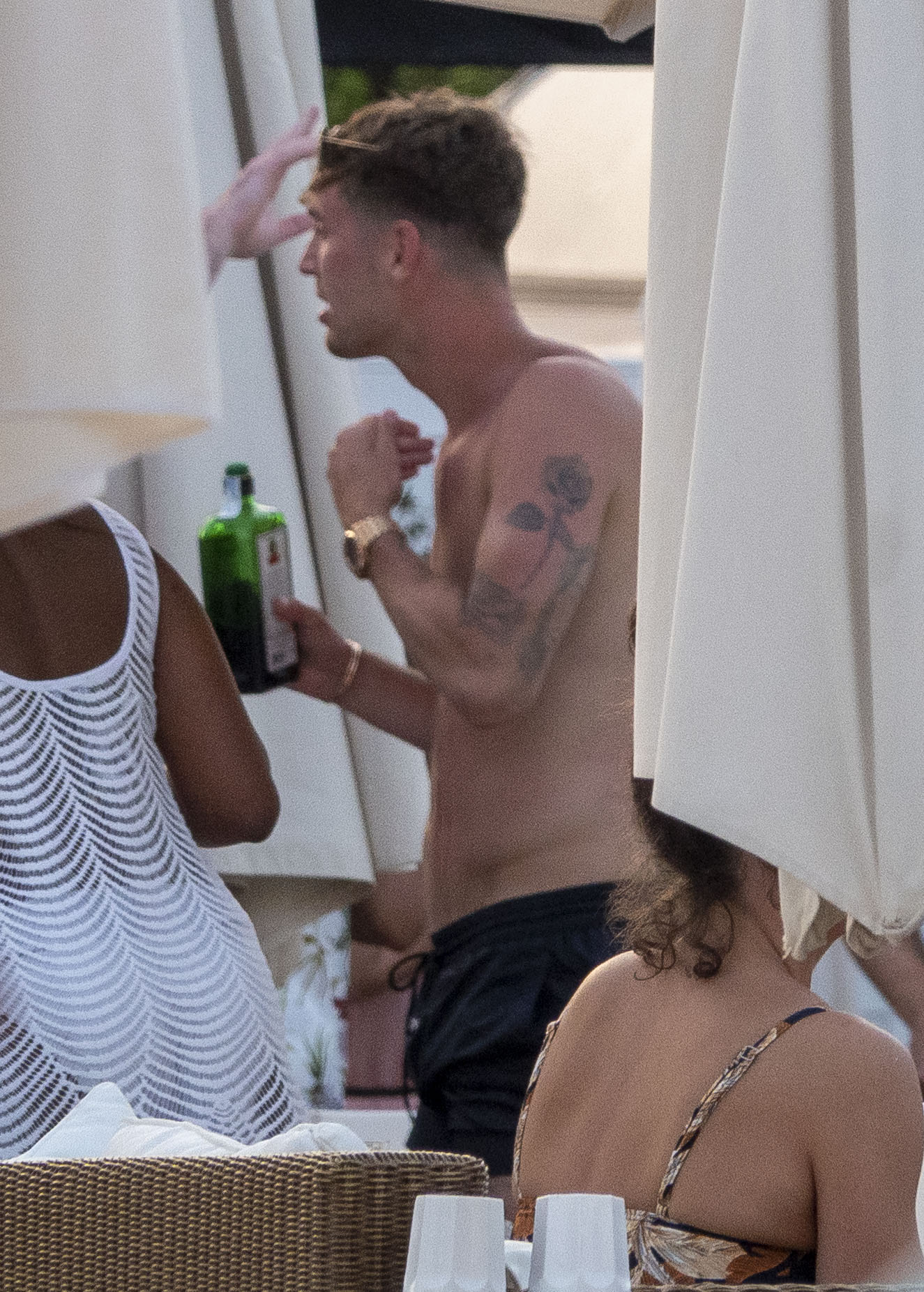 John Stones clutches a bottle of Jager