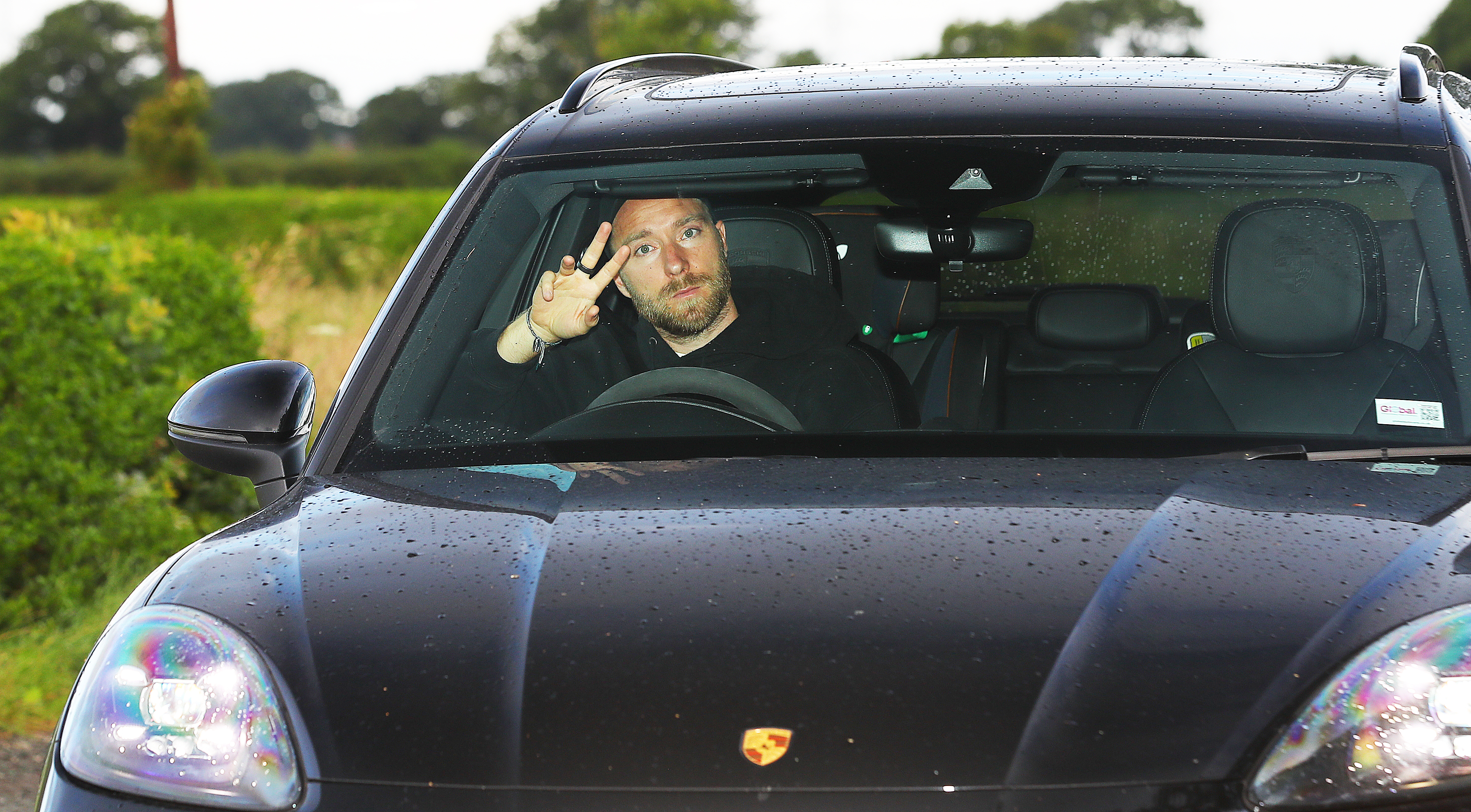 Christian Eriksen flashed a wave to cameras