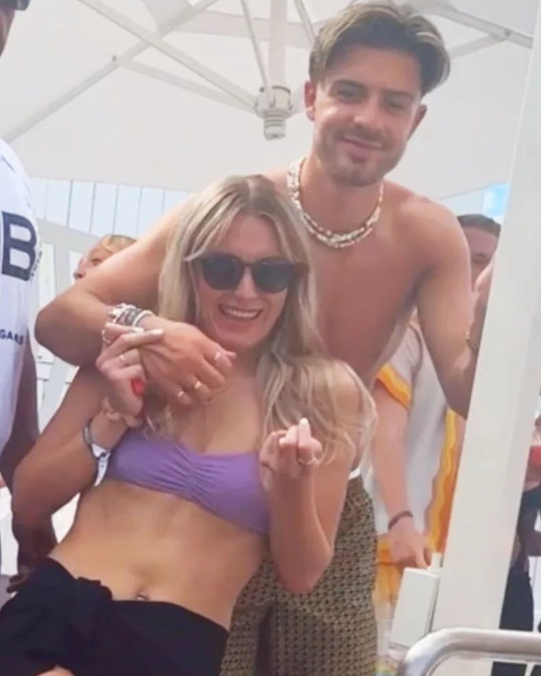 Jack Grealish put his arm around Holly Wells at the O Beach Club in Ibiza