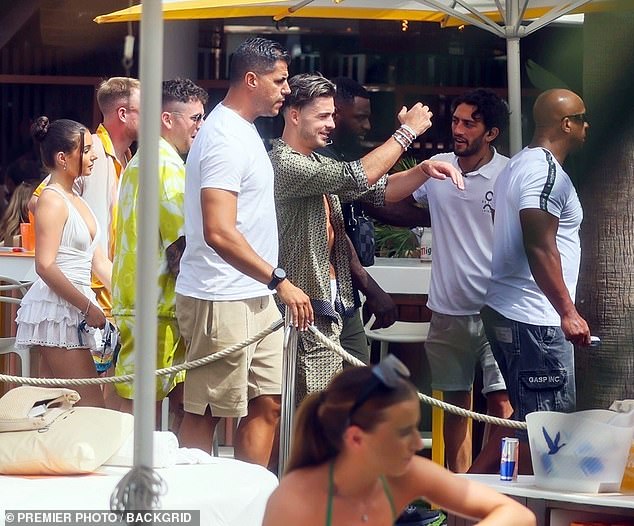 The party continues! Man City star Jack Grealish continues to live it up in Ibiza as he plays a back-to-back set with DJ Fisher in Hi nightclub - before posing with Wayne Lineker - Go News